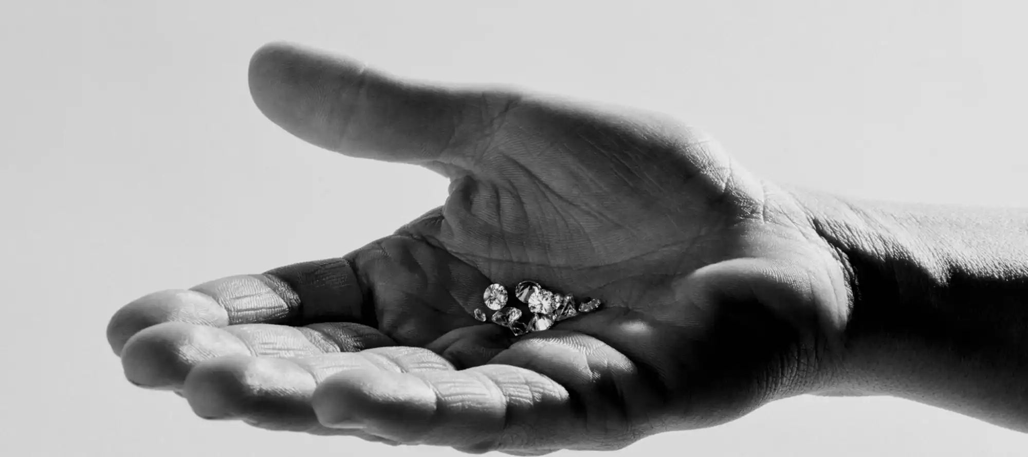 Diamond ring in palm.