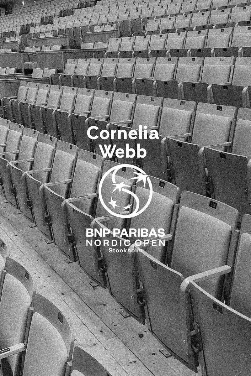 An empty stadium or theater with rows of seats.