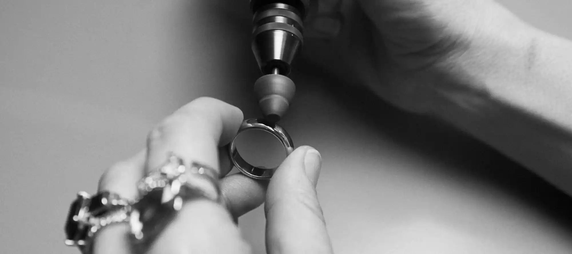 Jeweler polishing a ring.