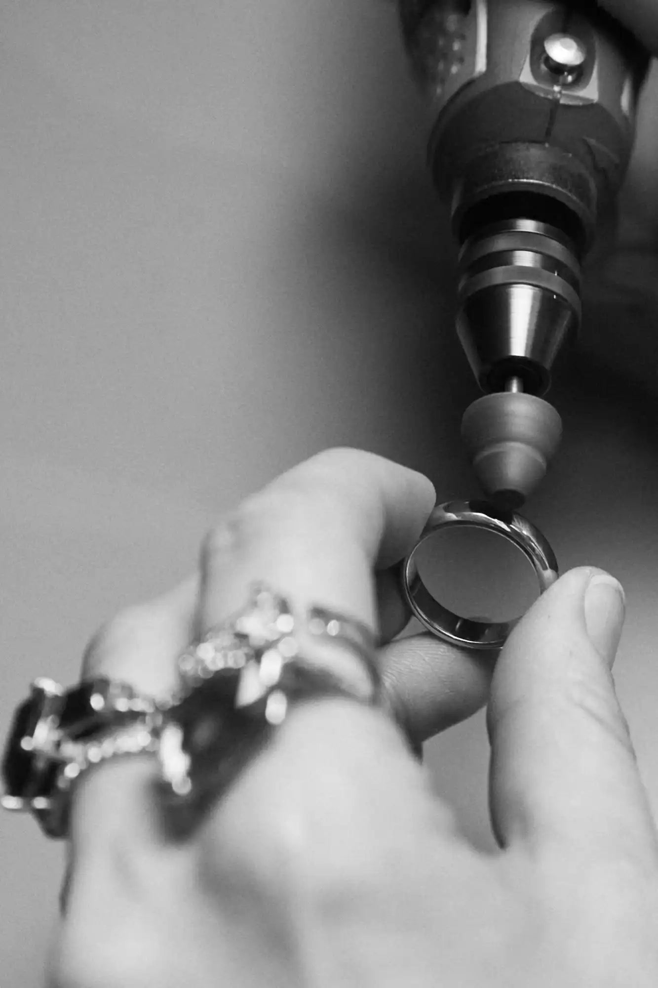 Jeweler polishing a ring.