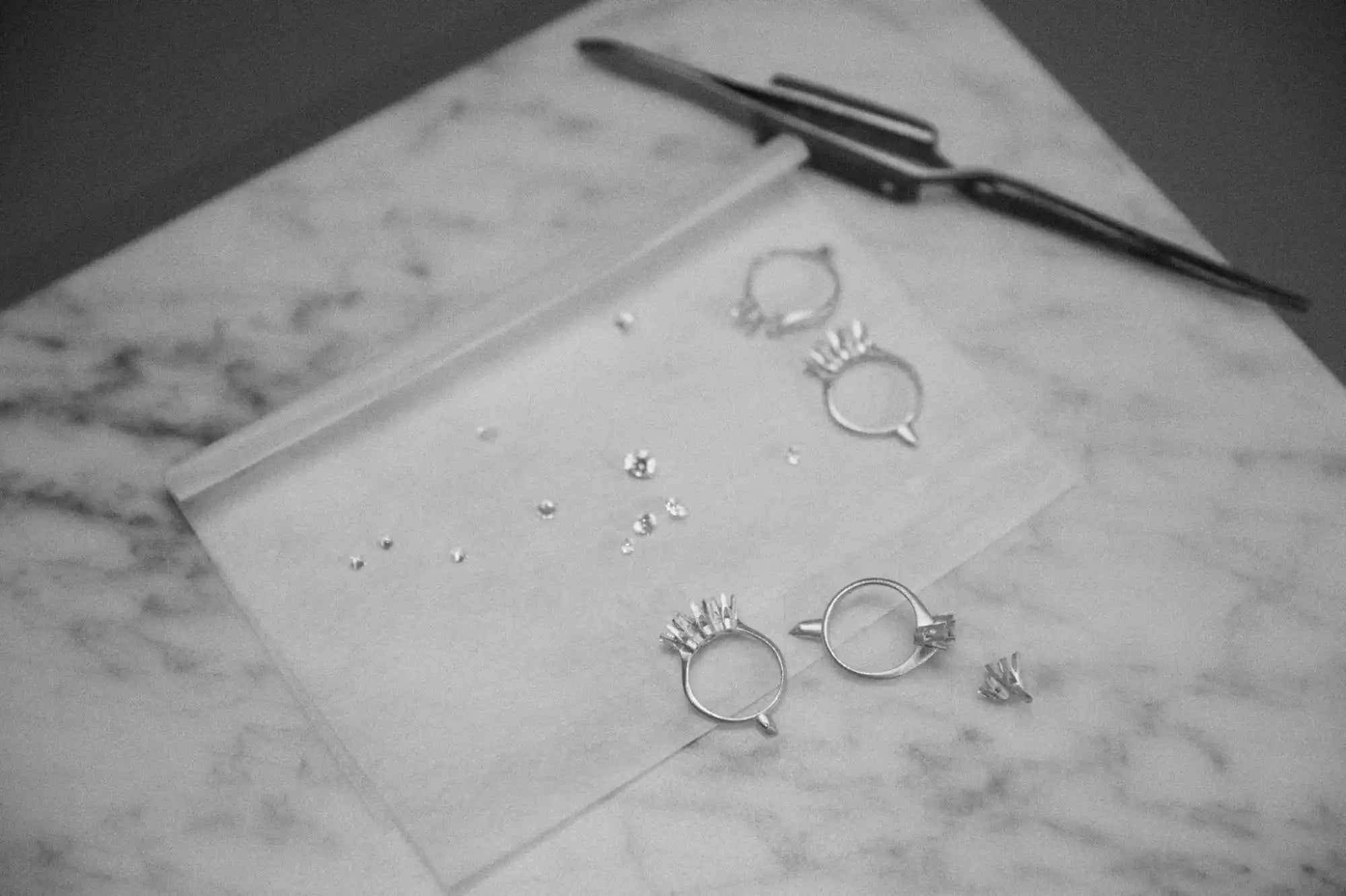 Jewelry making with rings and diamonds.