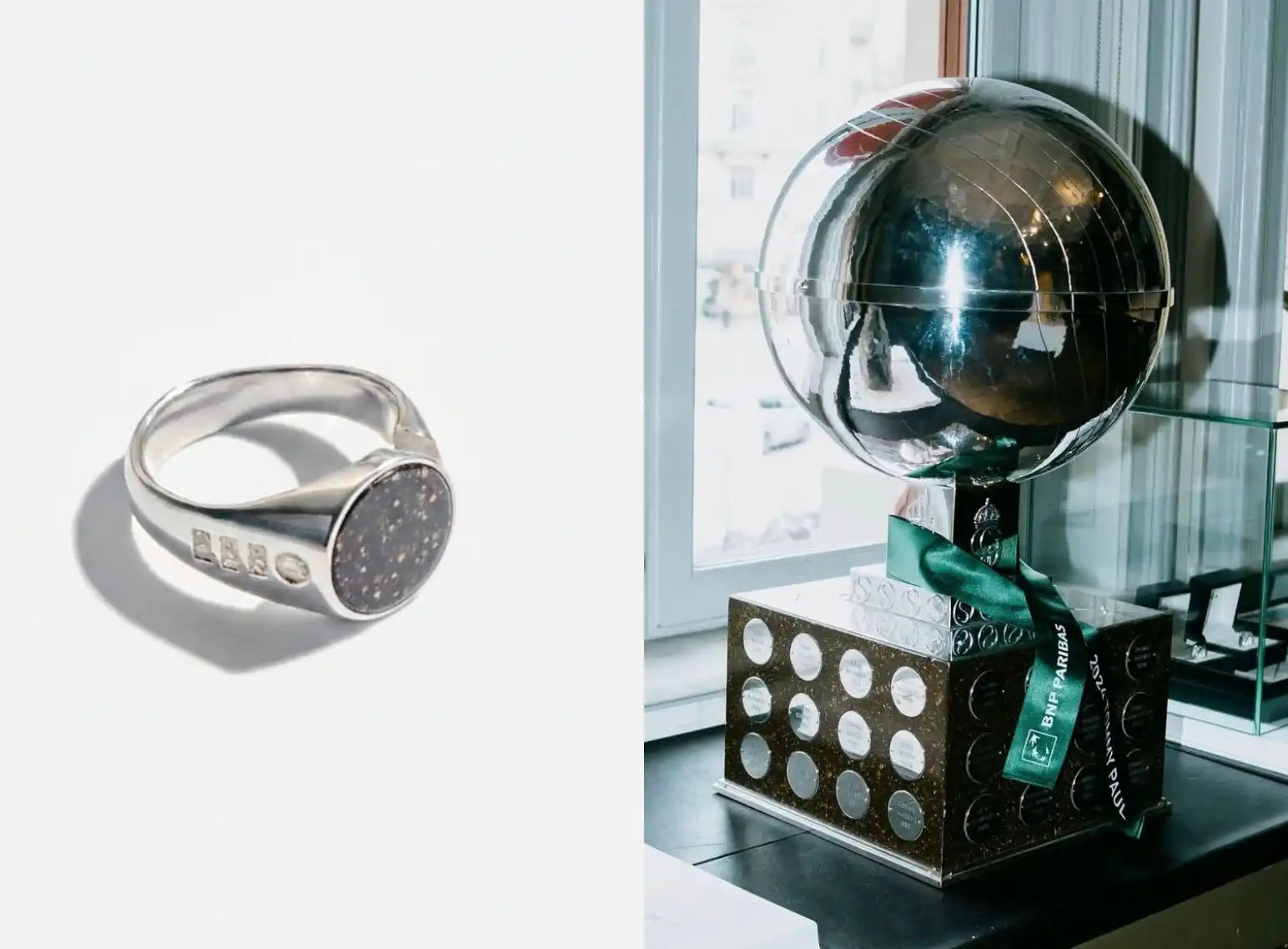 Silver signet ring with a speckled black face.