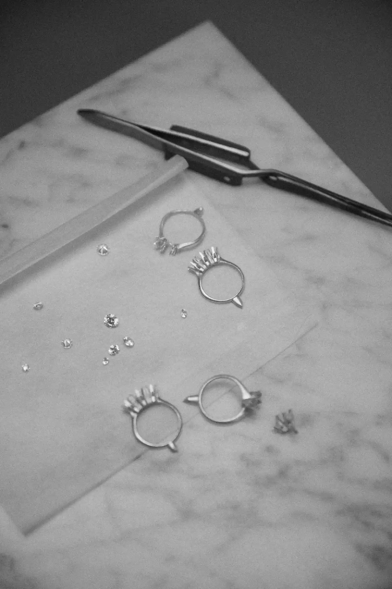 Jewelry-making tools and rings.